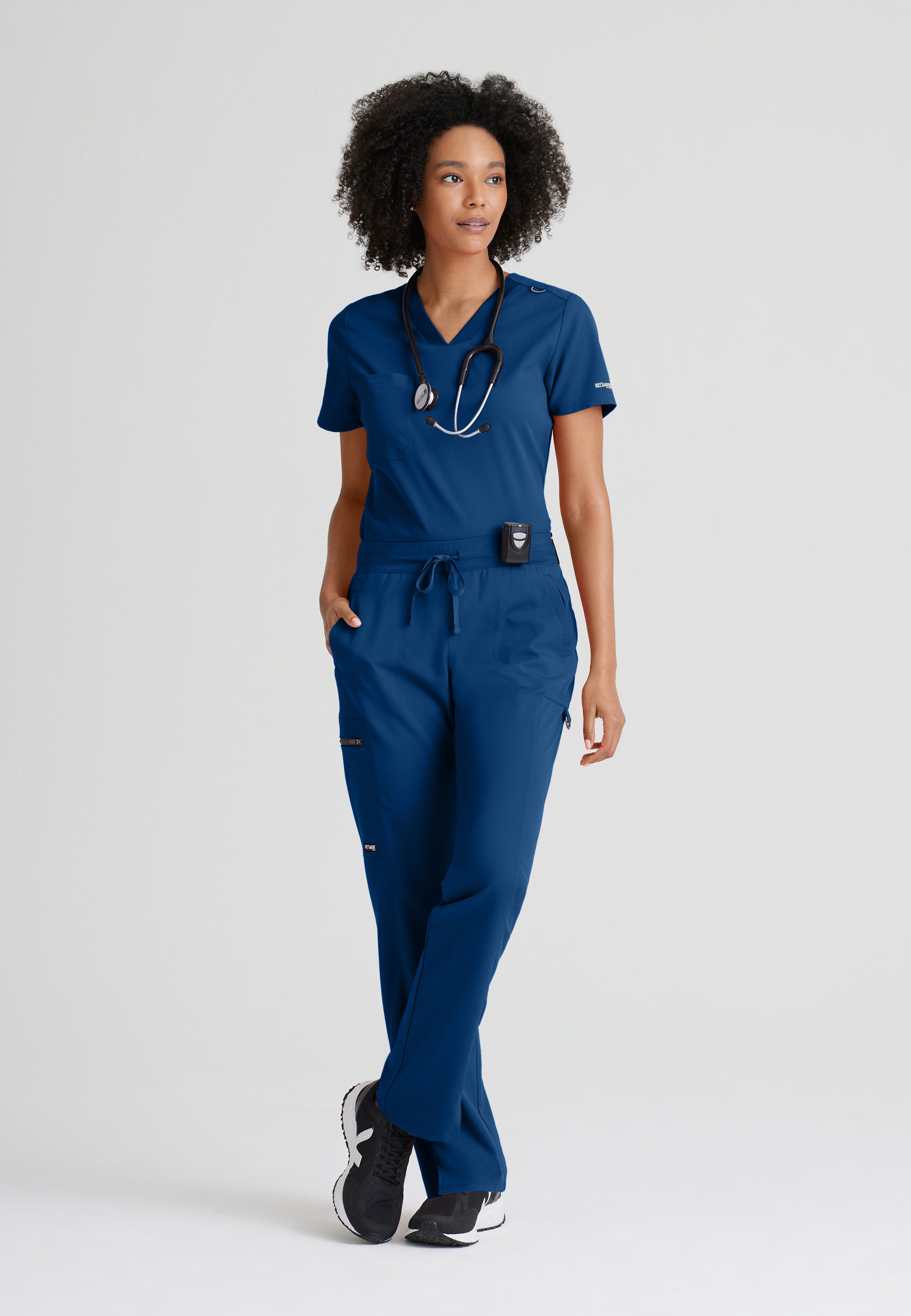 Full Body View of the Bree 1-Pocket Tuck-In Scrub Top in Indigo from Grey's Anatomy™ by Barco Spandex Stretch