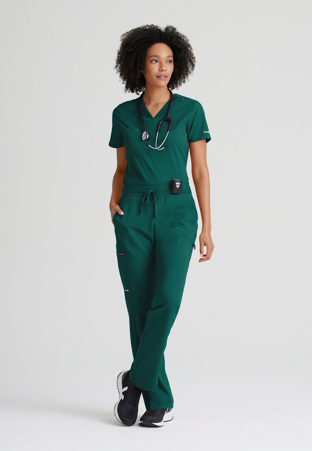 Full Body View of the Bree 1-Pocket Tuck-In Scrub Top in Hunter Green from Grey's Anatomy™ by Barco Spandex Stretch