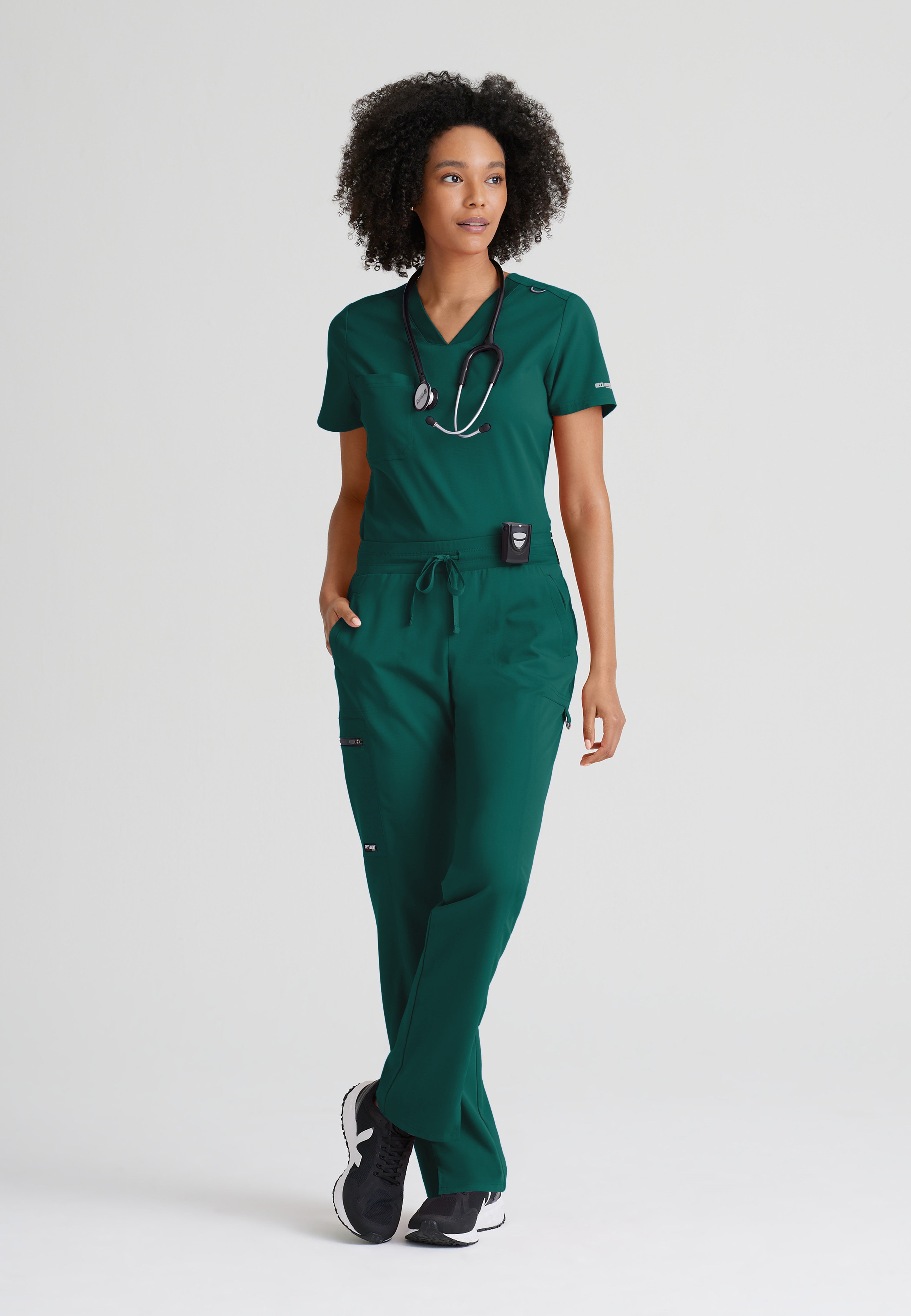 Full Body View of the Bree 1-Pocket Tuck-In Scrub Top in Hunter Green from Grey's Anatomy™ by Barco Spandex Stretch
