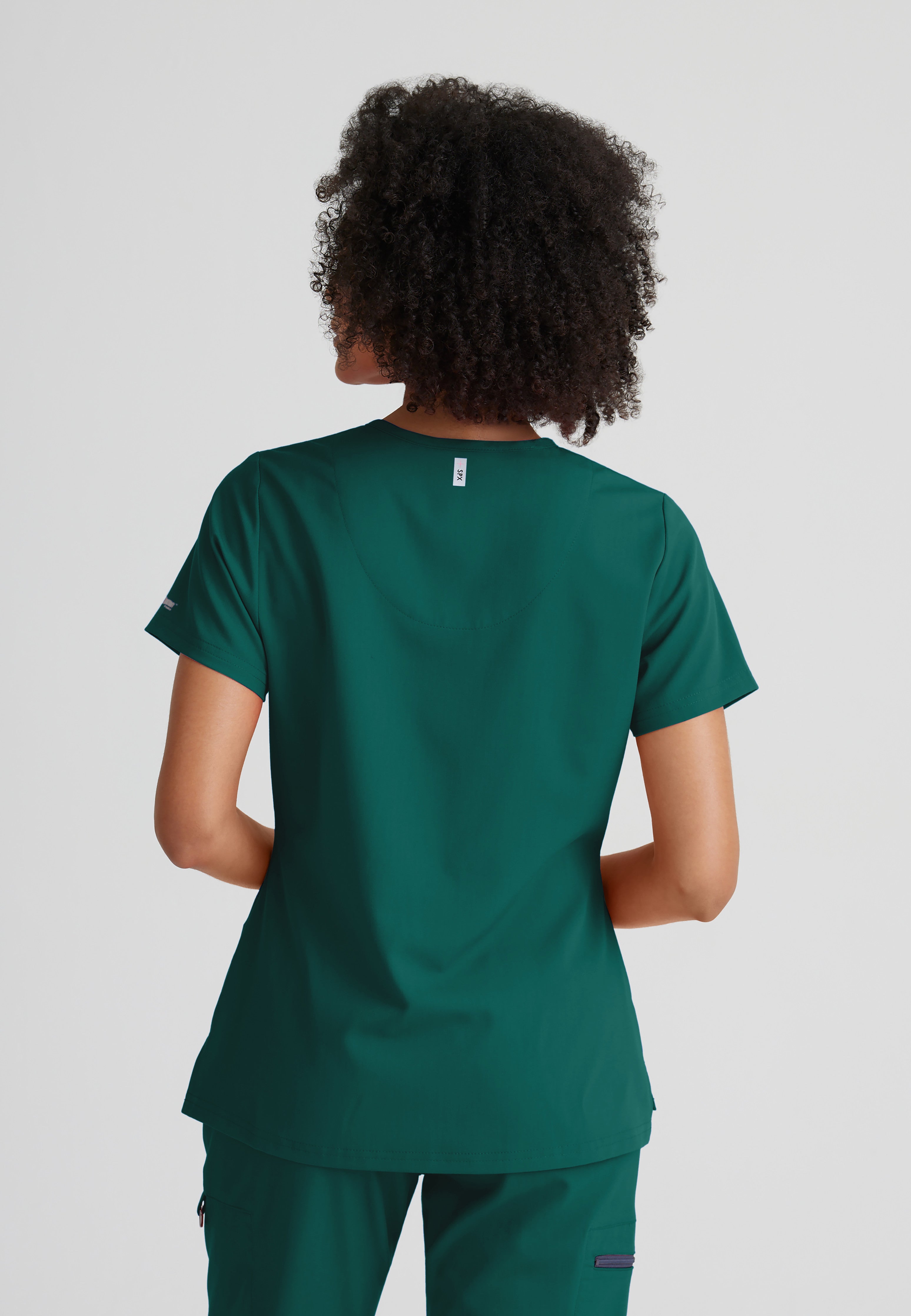 Back View of the Bree 1-Pocket Tuck-In Scrub Top in Hunter Green from Grey's Anatomy™ by Barco Spandex Stretch