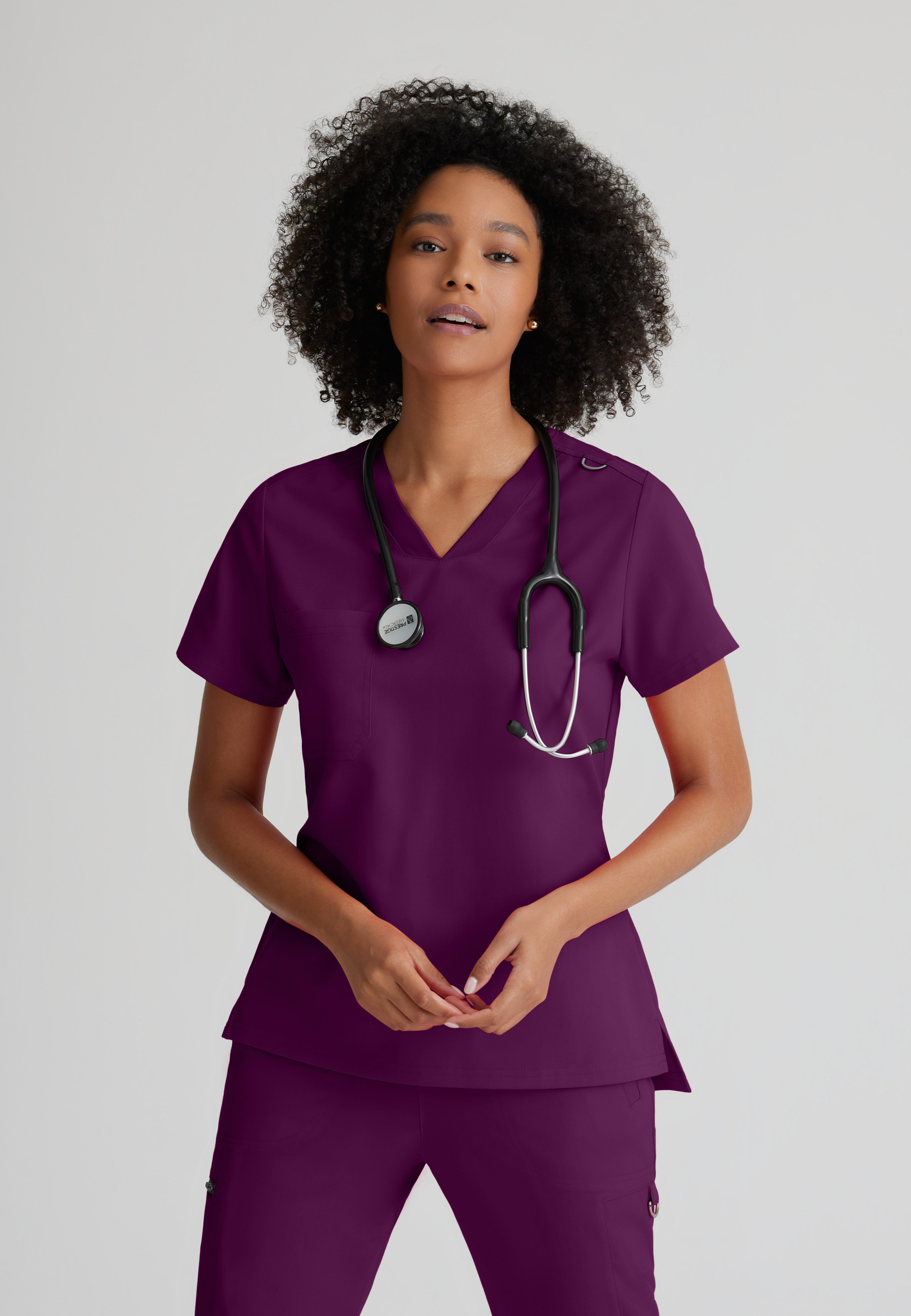 Front View of the Bree 1-Pocket Tuck-In Scrub Top in Wine from Grey's Anatomy™ by Barco Spandex Stretch
