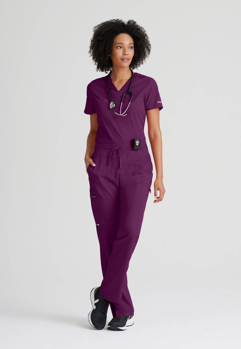 Full Body View of the Bree 1-Pocket Tuck-In Scrub Top in Wine from Grey's Anatomy™ by Barco Spandex Stretch