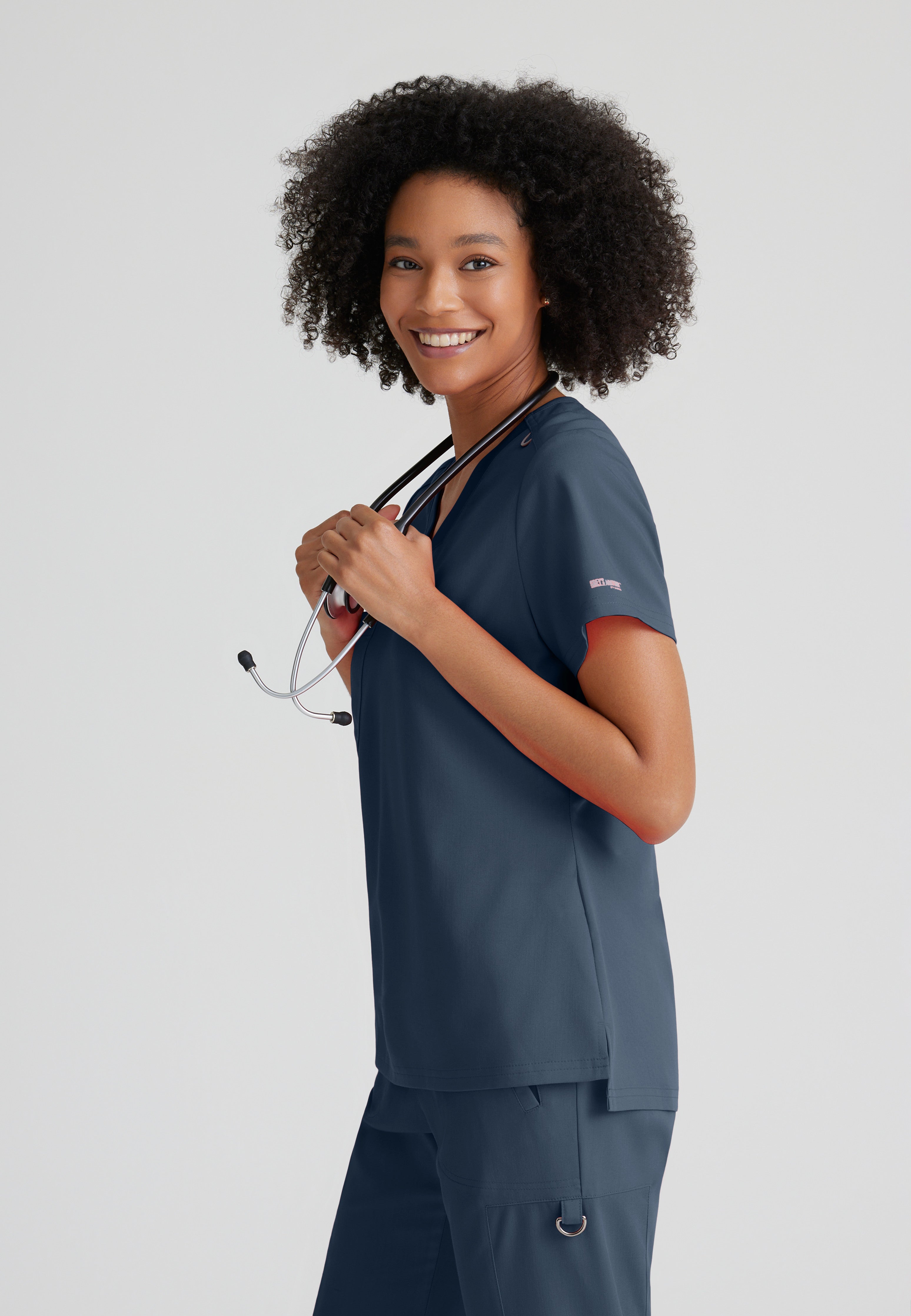 Side View of the Bree 1-Pocket Tuck-In Scrub Top in Steel from Grey's Anatomy™ by Barco Spandex Stretch