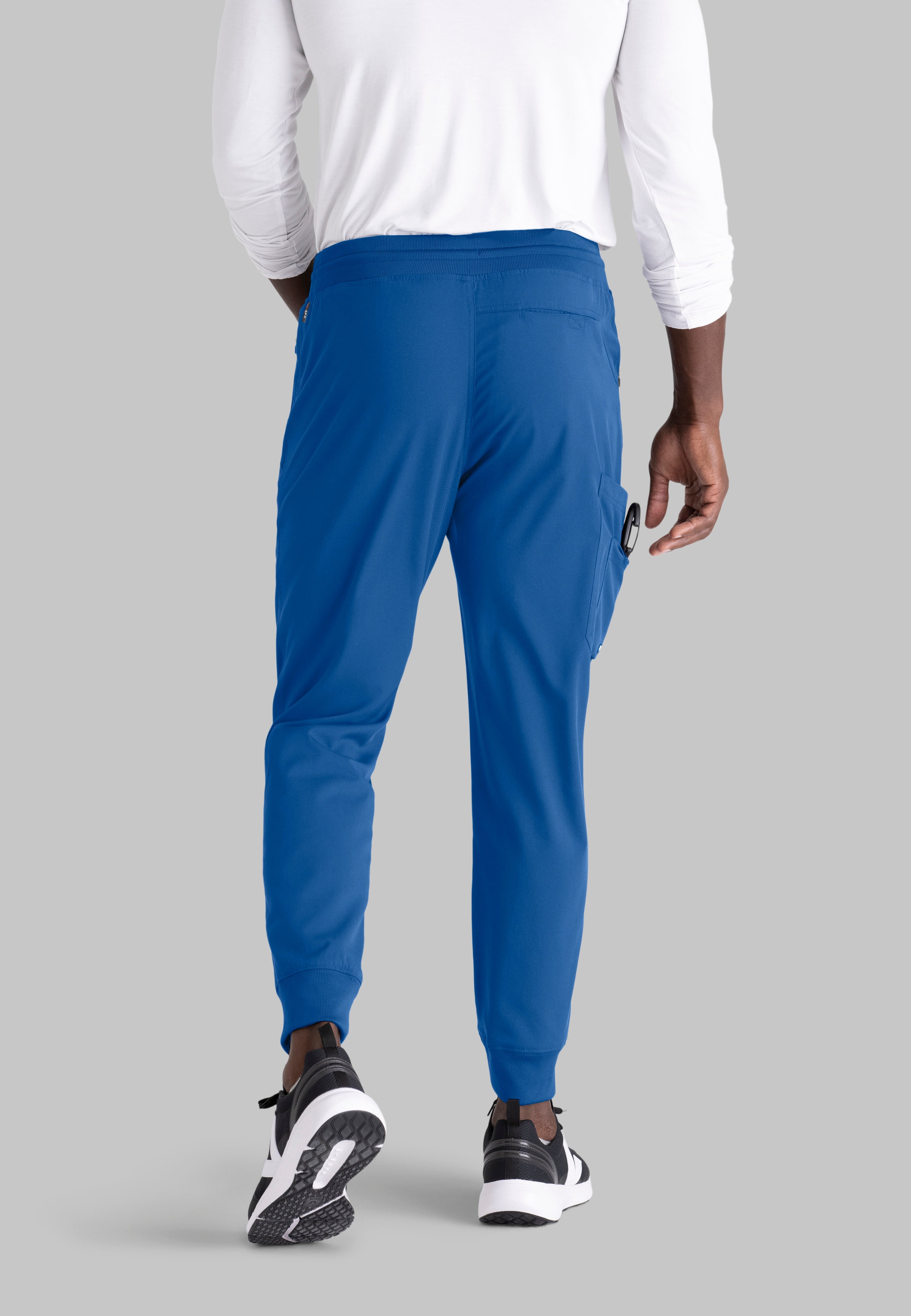 Grey's Anatomy Spandex-Stretch Men’s royal Zip-Fly 5-Pocket Jogger Scrub Pant. Elastic waistband with drawstring. Wrinkle-resistant, easy care fabric. 