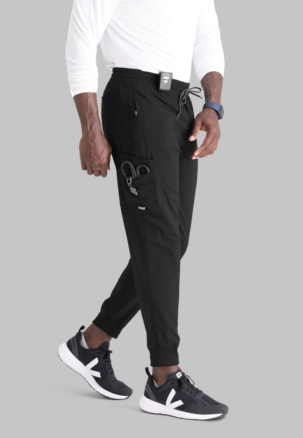 Grey's Anatomy Spandex-Stretch Men’s black Zip-Fly 5-Pocket Jogger Scrub Pant. Elastic waistband with drawstring. Wrinkle-resistant, easy care fabric. 